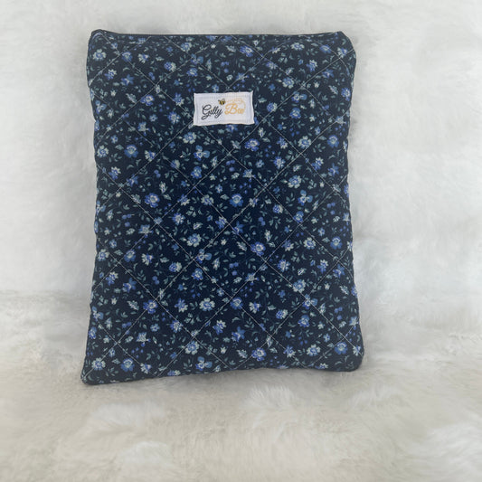 Navy Floral-patterned book sleeve on a white surface