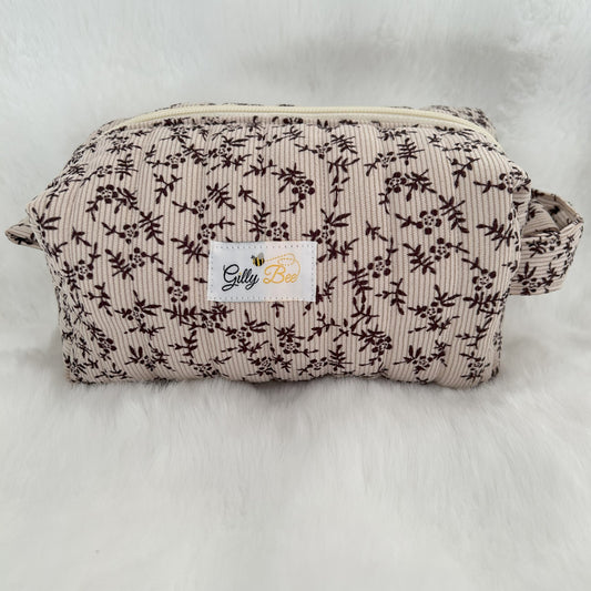 Autumn leaves fabric on a quilted pouch with a visible Gilly Bee brand label 