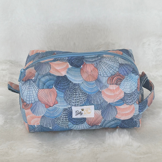 Cosmetic bag with shell pattern on a white background