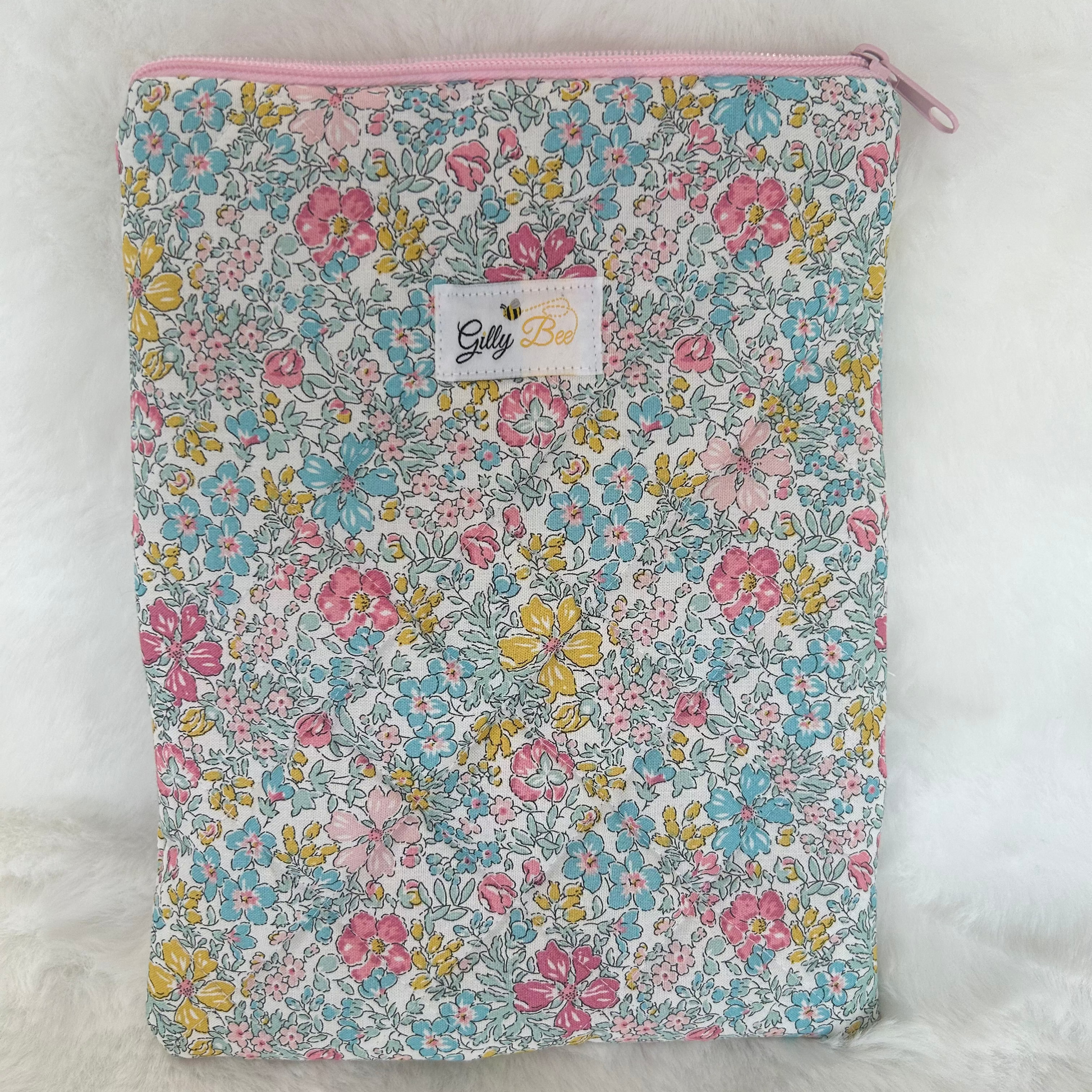 Liverty Floral patterned book sleeve with a visible Gilly Bee brand label on a white background